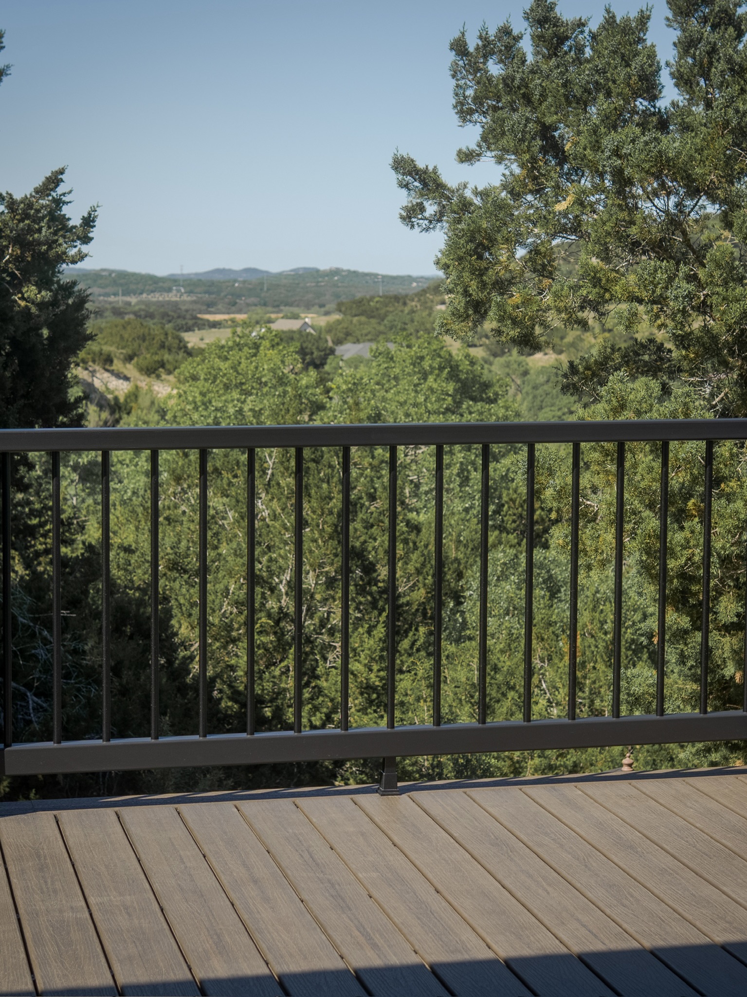 Custom backyard deck with railing in Helotes TX