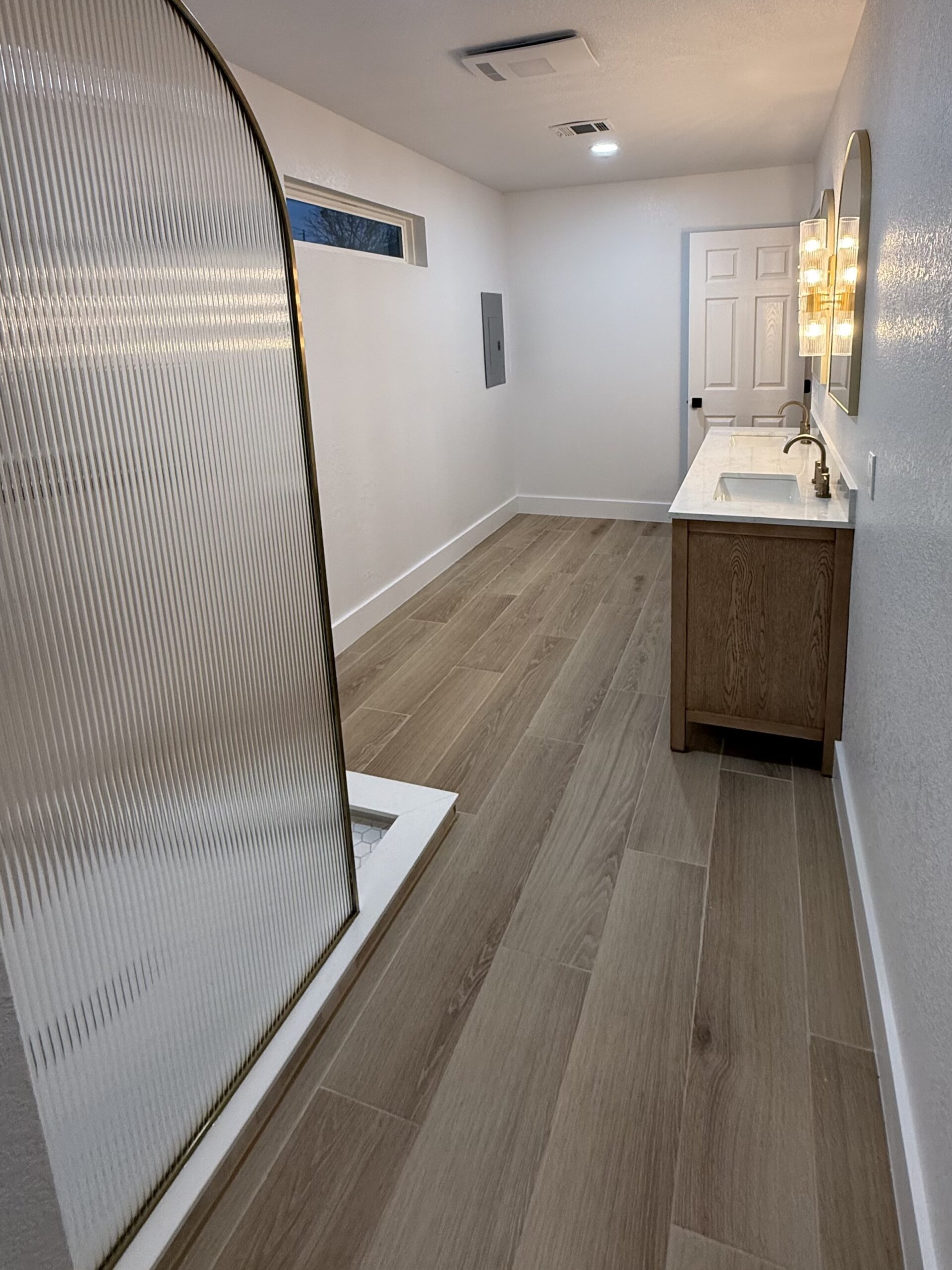 Texas Hill Country bathroom renovation featuring walk-in shower, new flooring, and custom finishes